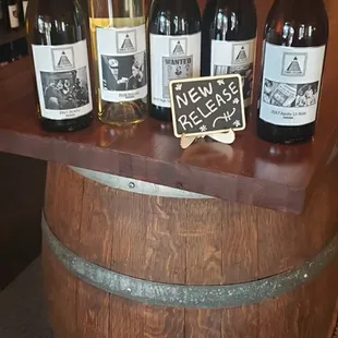 a selection of wine bottles on a barrel