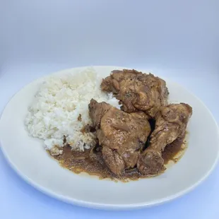 Chicken Adobo with Rice- chicken, onion, garlic, soy sauce, vinegar, herb and spices