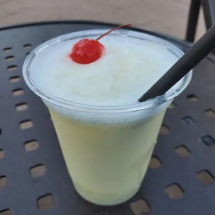a drink with a cherry on top
