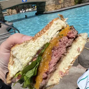 Burger with cheddar cheese, ordered medium rare.