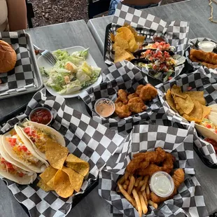 fish tacos, chicken tacos, fried pickles,  fish and chips