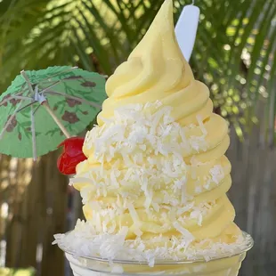 Pineapple Dole sundae.  Pineapple dole whip  Toasted coconut  Cake