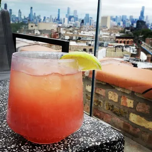 a view of the city from a rooftop bar