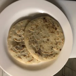 two tortillas on a white plate