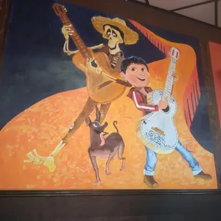 a painting of a mexican musician and a dog