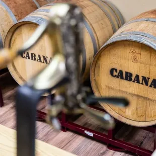 barrels of wine on a rack