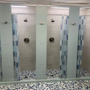 Common area bathroom has 6 showers, 3 sinks, 3 toilets. Very clean