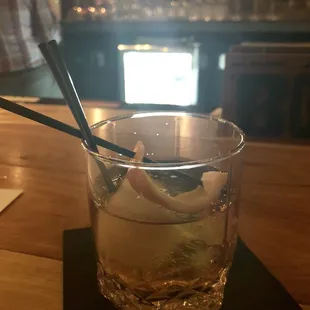 a drink in a glass with a spoon