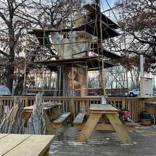 Huge patio during the warmer days! This awesome wood carving in the making!