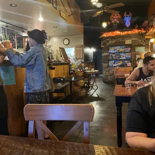 a woman standing at the bar