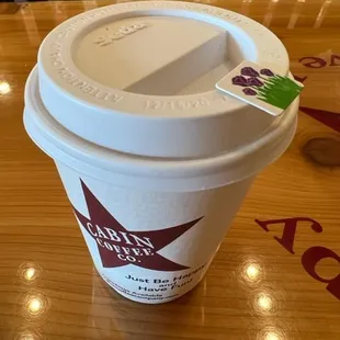 Coffee cup with mouth sticker