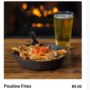 poutine fries and a glass of beer