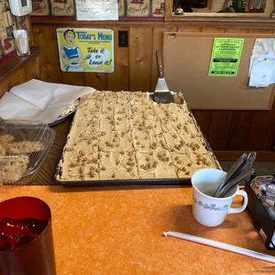 a tray of cake and a cup of coffee