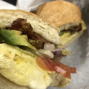 bacon egg cheese avocado on ciabatta w all the fixings.