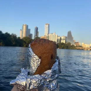 a hand holding a piece of food