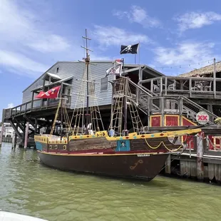 a pirate ship docked at a dock