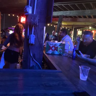 people sitting at a bar