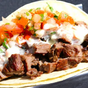 a closeup of a beef taco