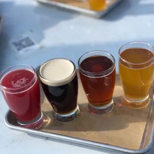 Beer flight! Blackberry Gose, Nitro Boxcar Brown Ale, Bourbon Aged Cherry Pie Maibock, Liquid Sunshine Sour Ale