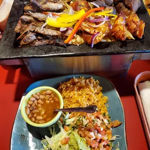 Parrilladas with quail, carnitas, bacon and jalapeño shrimp, sausage, and fajita beef. It was soo good!
