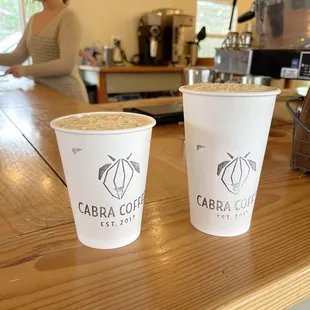 two cups of coffee on a counter