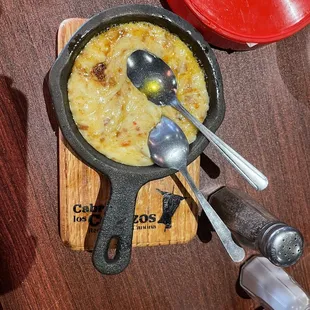  person holding a spoon and spoon