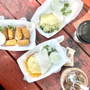 three baskets of food on a picnic table