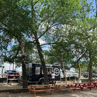 a food truck parked in a park
