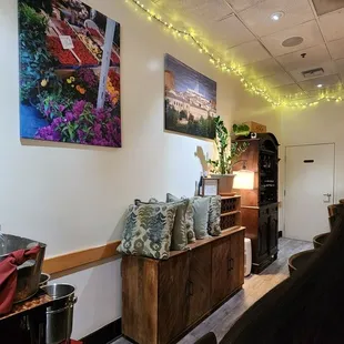 a living room with a couch and a painting on the wall