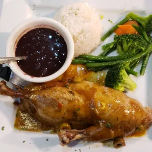 a plate of chicken, rice, and broccoli
