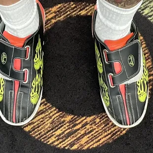 a man's feet in a pair of sneakers