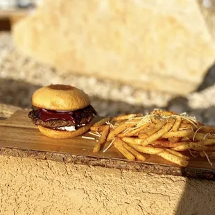 Blue Feta burger: house made blueberry bbq sauce, feta cheese, and pickled onions.