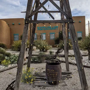 a wooden structure with a sign on it