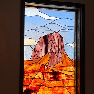 Stained glass image of Guadalupe Peak, at the Cactus Cafe in White's City, NM.
