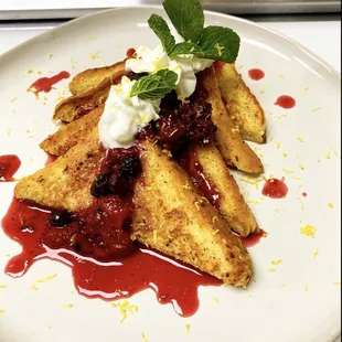Berry French toast: house made berry syrup, house made whipped cream, topped with lemon zest, and mint.