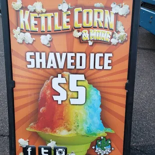 a sign advertising a shaved ice