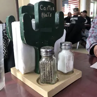 a table with salt and pepper shakers