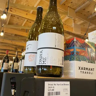 two bottles of wine on a shelf