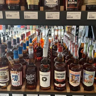 a variety of liquor bottles on a shelf