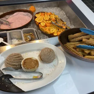 Yogurt, oranges, concha&apos;s, churros