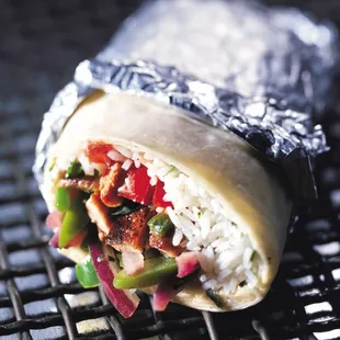 a burrito wrapped in aluminum foil