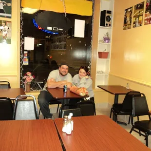 a man and a woman sitting at a table