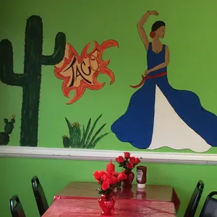 a woman dancing in a blue dress