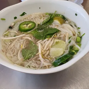 Sliced beef and meatball pho.