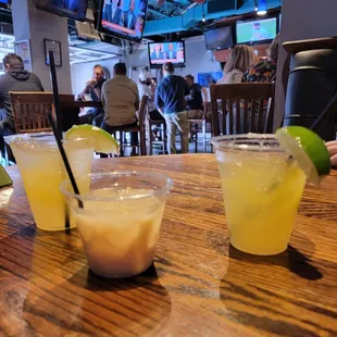 three drinks on a wooden table