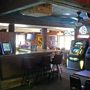 a bar with arcade machines