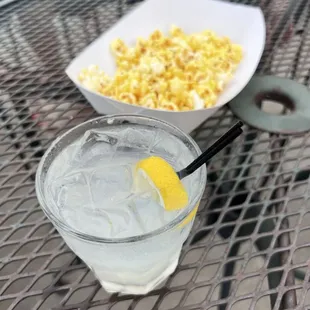 a bowl of macaroni and cheese and a glass of water