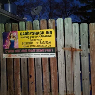 a sign on a fence