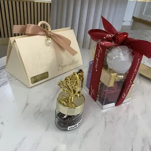 Gift boxes filled with assorted chocolates and chocolate covered coffee beans.