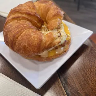 Croissant breakfast sandwich loaded with bacon and eggs!